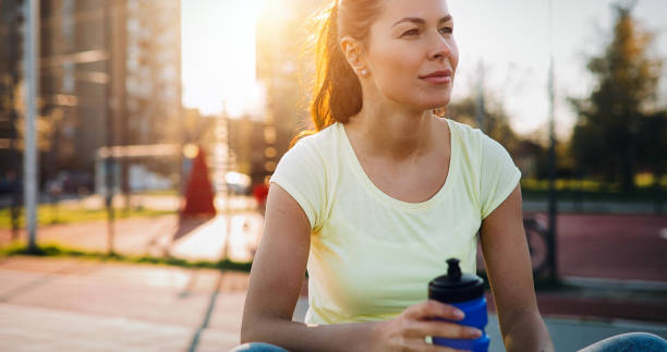 istock Thirsty sportswoman doing her jogging training 1039491042