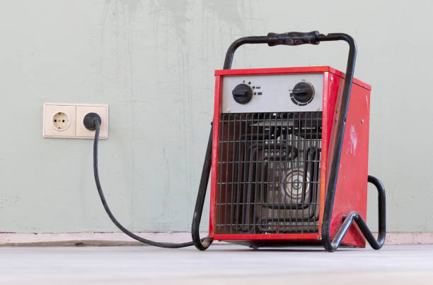 istock Compact red heater, drying the floor 1039494586