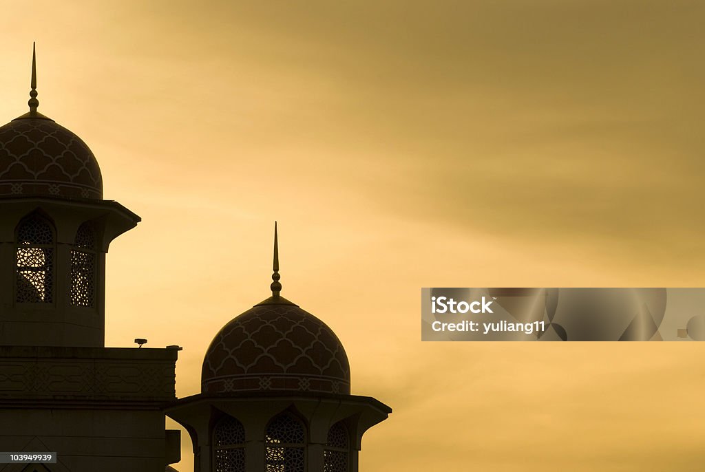 Silhouette of mosque at sunset mosque silhouette during sunset with some space on right side for concept purpose Allah Stock Photo