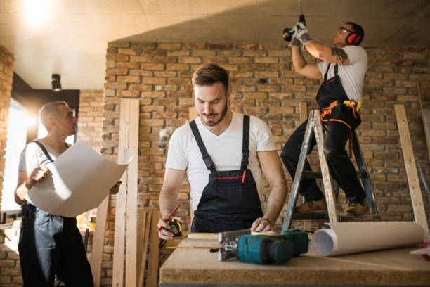 istock Busy construction workers working on home improvement in the apartment. 1039504792