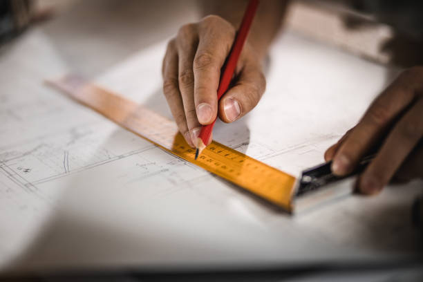 istock Close up of unrecognizable architect improving housing project. 1039504984