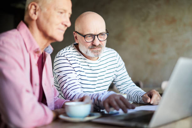 istock Concentrated thoughtful colleagues editing file on laptop while analyzing online information in coffee shop 1039505422