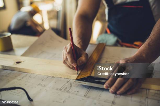 Close Up Of Unrecognizable Worker Drawing On Wood Plank Stock Photo - Download Image Now