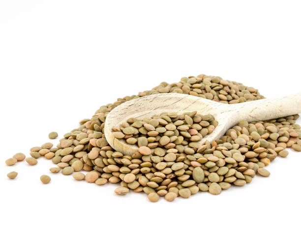 istock Heap of green lentil isolated 1039511748