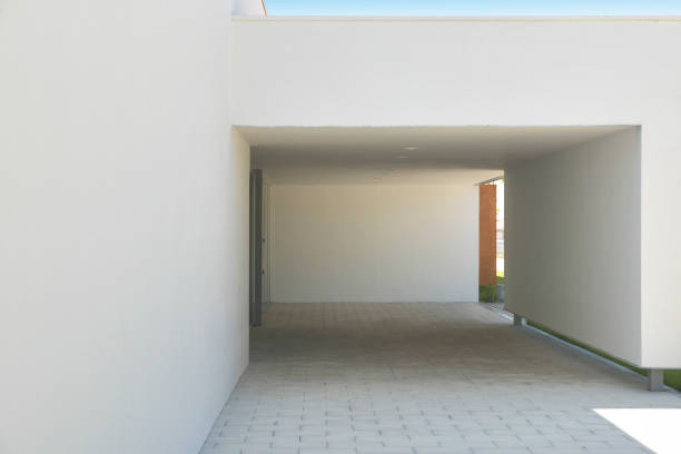 istock Modern building entrance and white facade. Minimalism architecture 1039511912