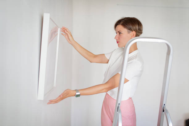 istock Hands off framed picture placed on the wall 1039513710