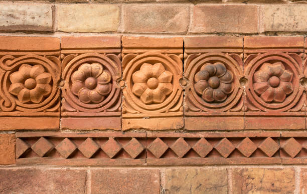 istock Red Brick Wall with flowers decorations and tiles 1039517282