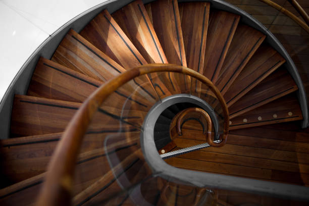 istock Wooden spiral staircase, view from above 1039520728