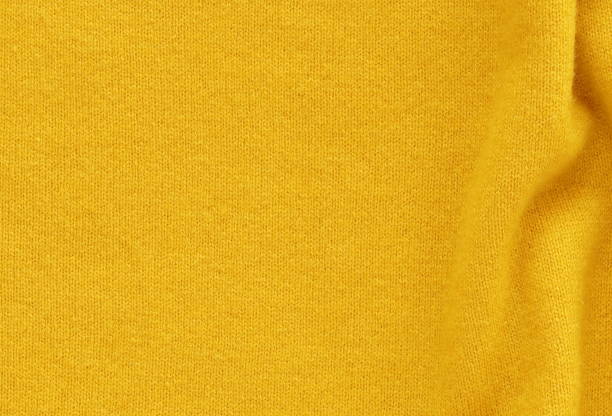 istock Yellow cashmere wool background texture , expensive luxury, fabric, material, needlework, sewing, wallpaper, cloth .close up. copy space 1039520842
