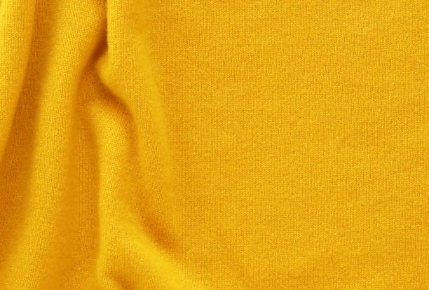 istock Yellow cashmere wool background texture , expensive luxury, fabric, material, needlework, sewing, wallpaper, cloth .close up. copy space 1039522542