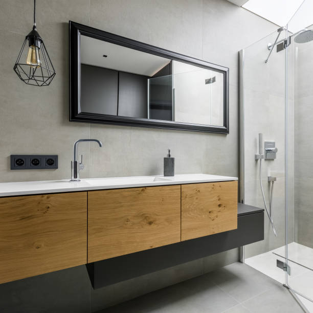 istock Modern bathroom with wooden cabinet 1039525378