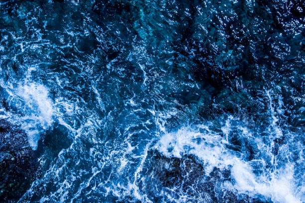 istock Blue deep sea foaming water background 1039532228