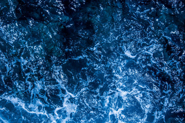 istock Blue deep sea foaming water background 1039532836