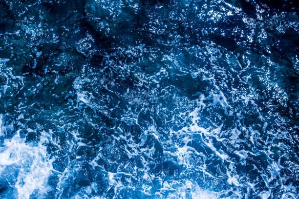 istock Blue deep sea foaming water background 1039532990