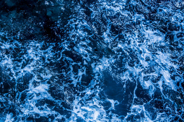 istock Blue deep sea foaming water background 1039533066