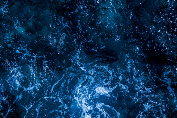istock Blue deep sea foaming water background 1039534212