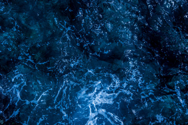istock Blue deep sea foaming water background 1039534300