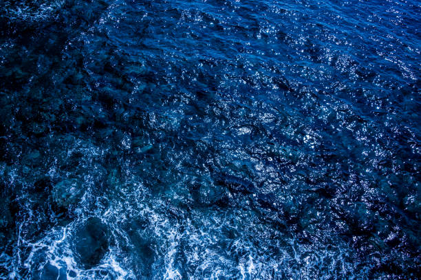istock Blue deep sea foaming water background 1039535476