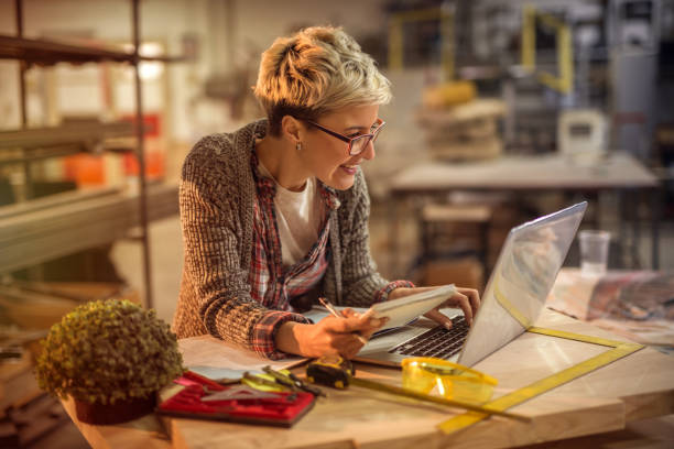 istock Beautiful creative young woman engineer working on laptop in her workshops. 1039537340