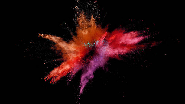 istock Explosion of coloured powder on black background. 1039540130
