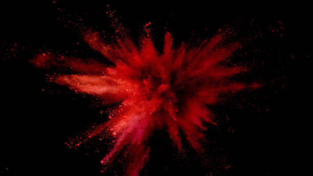 explosão de pó colorido sobre fundo preto. - vermelho - fotografias e filmes do acervo
