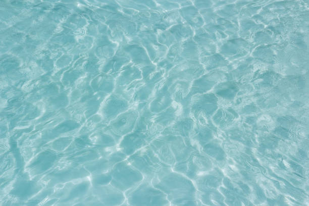 istock Shining light and reflections of blue water 1039545398