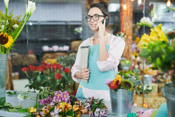 istock Modern Florist Speaking by Phone 1039551326