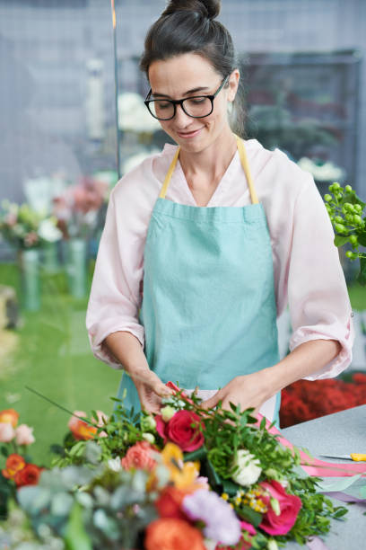 istock Florist Arranging Bouquets 1039551368