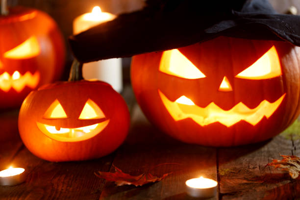 istock Halloween pumpkins with witches hat 1039554826