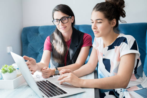 istock Two Young Women Studying in Cafe 1039557550