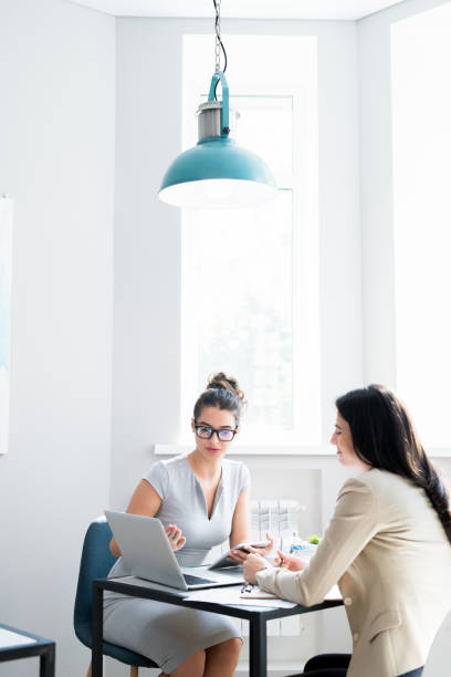 Business Meeting in Modern Cafe