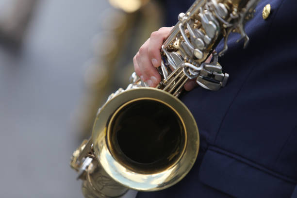 istock Military band member holding a saxophone 1039559184