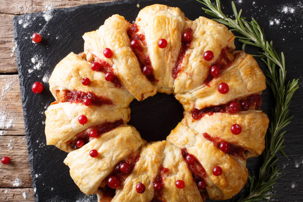 istock Appetizing chicken pie with cranberries and cheese close-up. Horizontal top view 1039560598