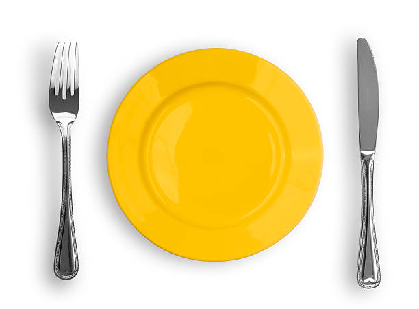istock Knife, yellow plate and fork isolated 103956297