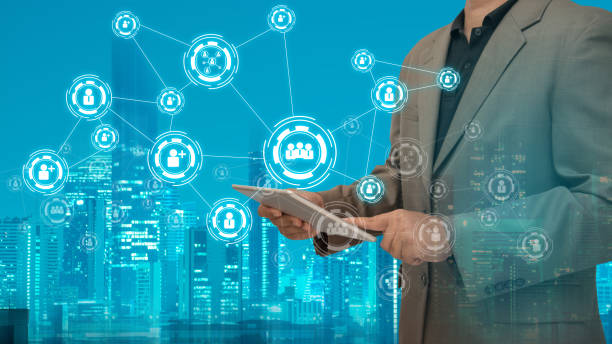 istock Digital Composite Image Of Businessman Using Digital Tablet By Various Icons In City 1039565450