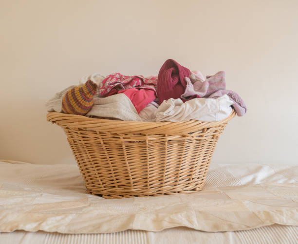 istock Clothes Against Wall In Wicker Basket At Home 1039567672
