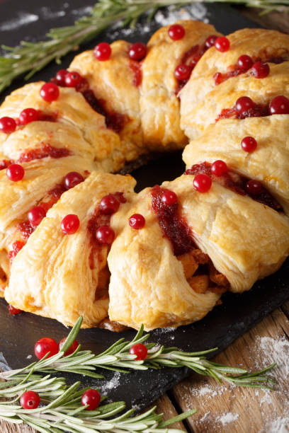 istock Appetizing chicken pie with cranberries and cheese close-up. vertical 1039569300