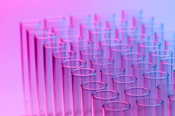istock Close-Up Of Test Tubes Against Colored Background 1039571648
