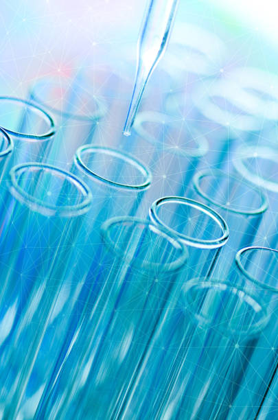 istock Close-Up Of Pipette On Test Tubes 1039571734