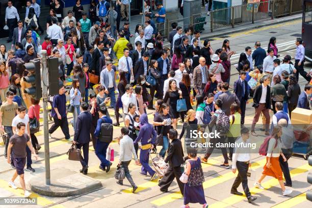 Busy Pedestrian Crossing At Hong Kong Stock Photo - Download Image Now - People, Demography, Crowd of People