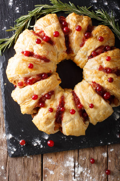 istock Appetizing chicken pie with cranberries and cheese close-up. Vertical top view 1039573322