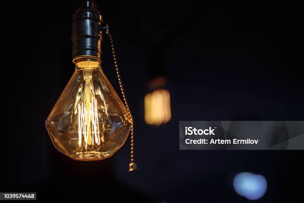 Garland Of Edison Lamps On Dark Background Stock Photo - Download Image Now - Edison - New Jersey, Light Bulb, Antique
