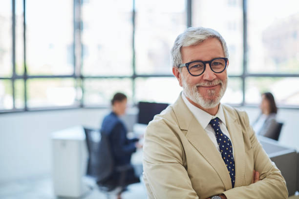 istock Business portrait. Looking at camera in an open space office. 1039577576
