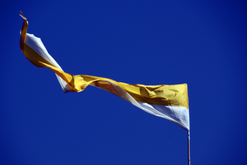Cyprus national flag waving in beautiful sky.