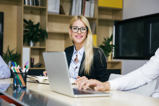 istock Attractive blond businesswoman working in modern office 1039582706