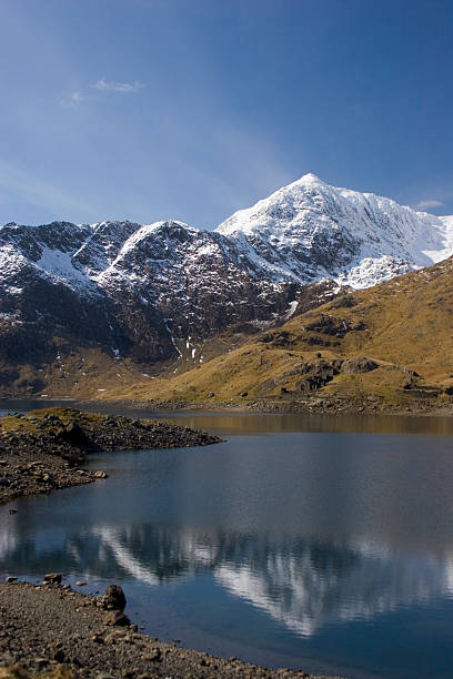 Snow-capped Snowdon The last of the winter snow clings to the summit of Snowdon, North Wales.  Taken with a Canon EOS 20D. mount snowdon photos stock pictures, royalty-free photos & images