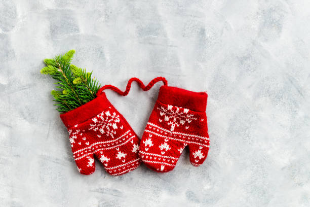 istock Christmas Red Knitted Mittens with Snowflake Motives 1039585264