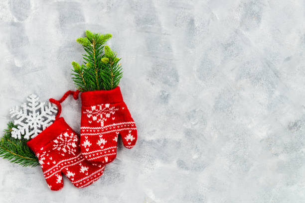 istock Christmas Red Knitted Mittens with Snowflake Motives 1039585304
