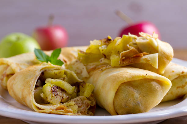 istock Apple cinnamon crepes. Pancakes with caramelized apples and cinnamon 1039586438