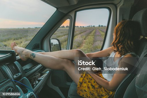 istock Woman looking at lavender field in Provence from camper van 1039586656